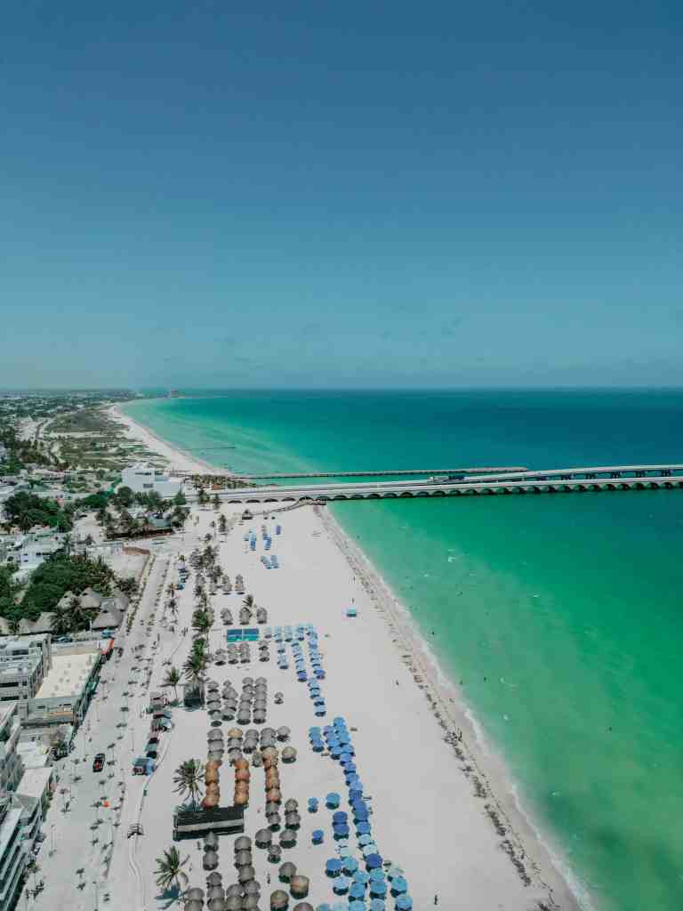 Why Merida Is One of the Safest Cities in Mexico to Invest in Real Estate 1 Aerial view of a beach and pier.